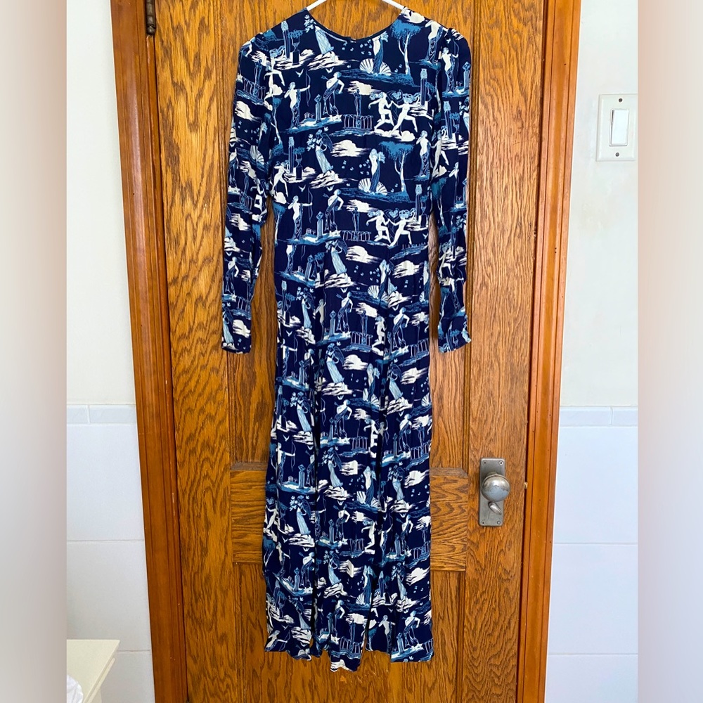 Reformation dress with peepholes in the back and high slit!